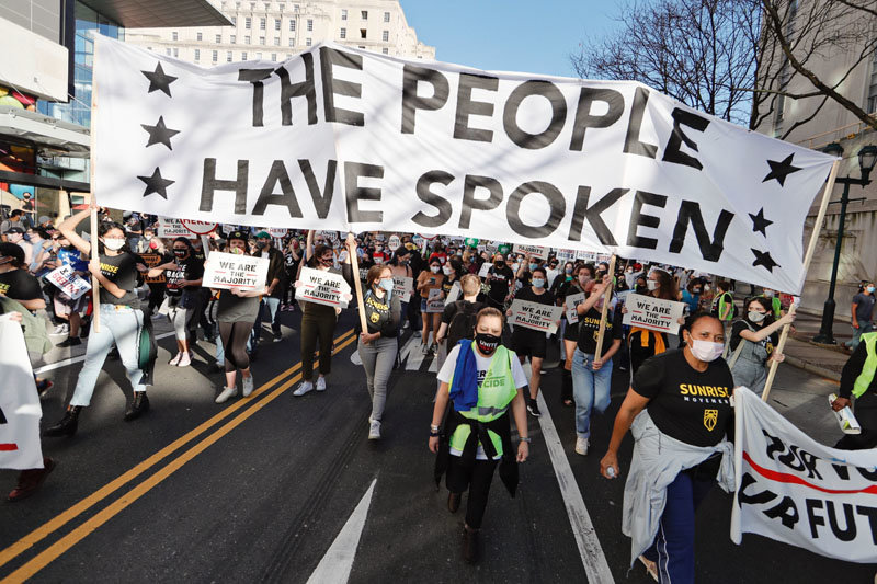 People take to the streets on the day the Associated Press and television networks projected that Joe Biden and Kamala Harris won Pennsylvania in the 2020 presidential election in Philadelphia on Nov. 7, 2020.