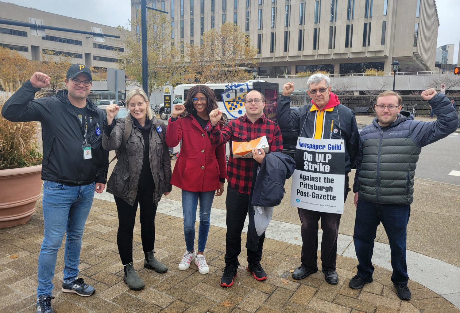 From left, guild members John Santa, Noelle Mateer, Tanisha Thomas, Joshua Axelrod, Ed Blazina and Andrew Goldstein stop for a photo while distributing pamphlets at Pitt on Monday, Oct. 31. (Photo courtesy of Pittsburgh Union Progress)